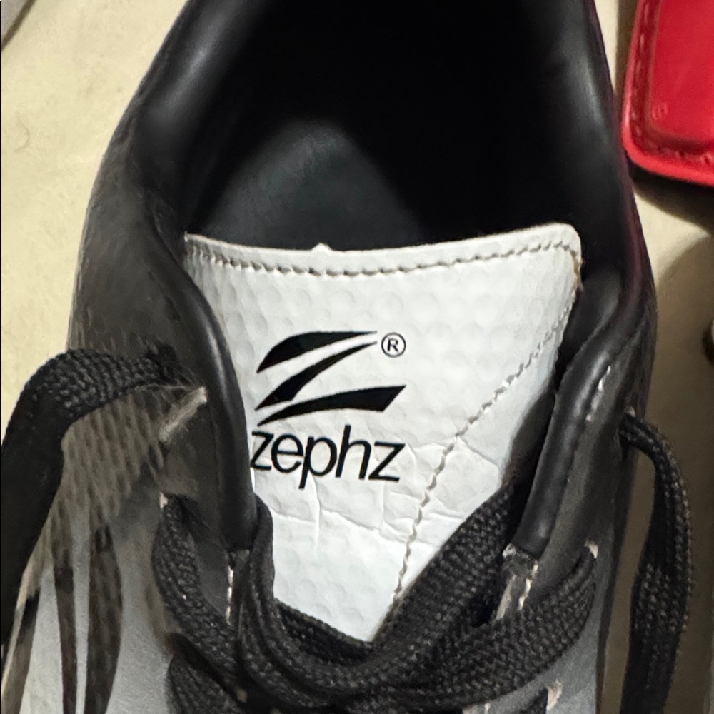 Zephyr Kids Shoes in White and Black and shin pads